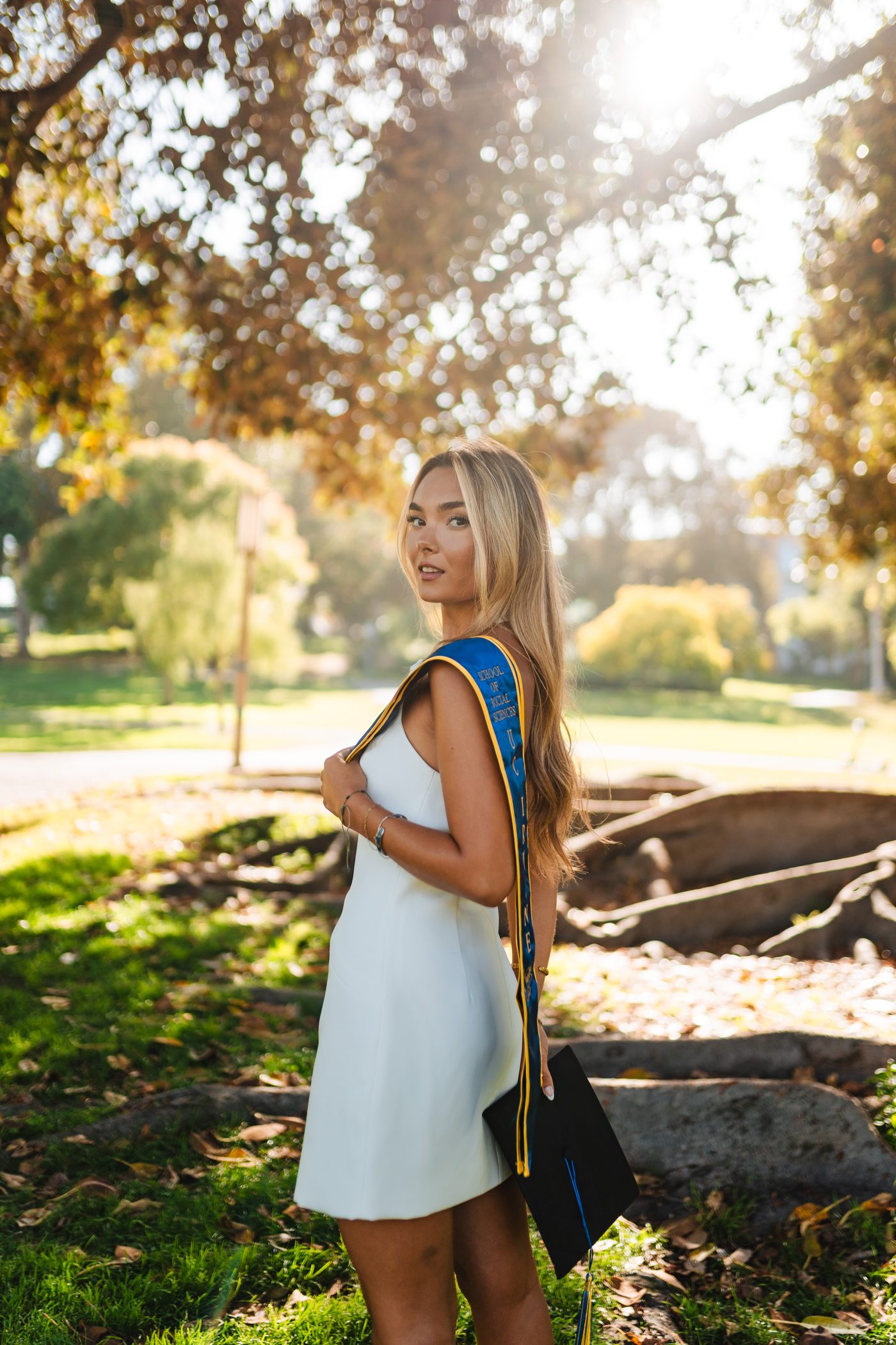 Graduate backlit by golden afternoon sun
